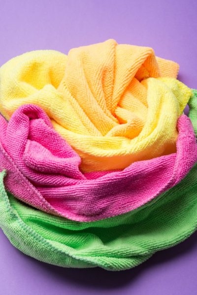 Background with microfiber set of colorful cleaning cloths